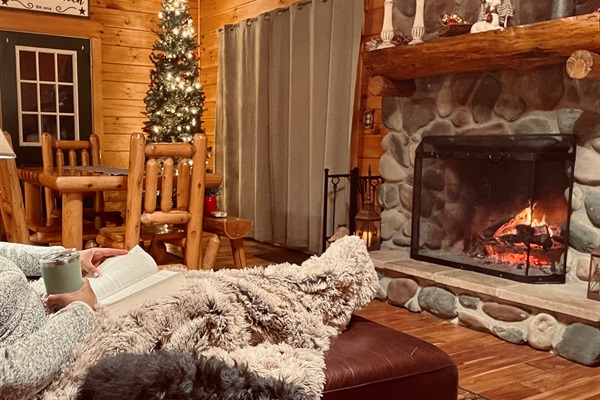 That has got to be the comfiest couch EVER, and a wood burning stone fireplace is A MUST for a Cozy Night in Hocking Hill!