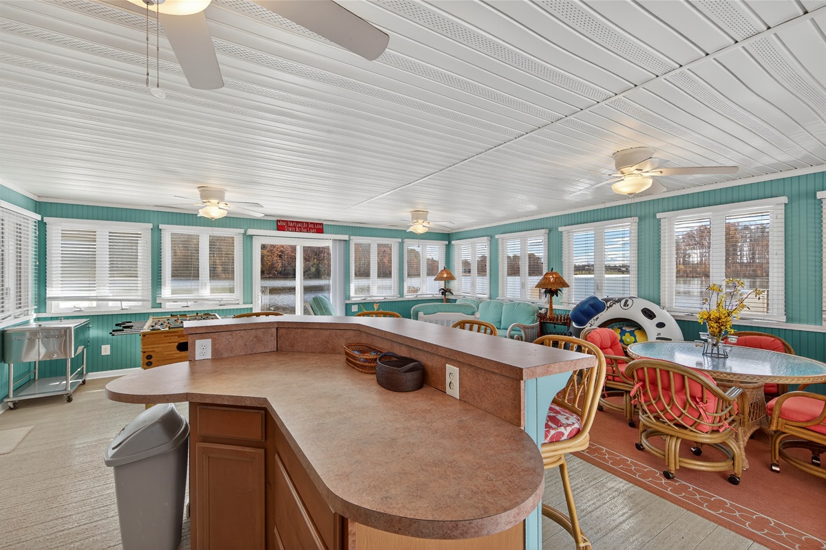 Bright lakeside kitchenette with bar seating—perfect for easy snacks and cold drinks by the water.