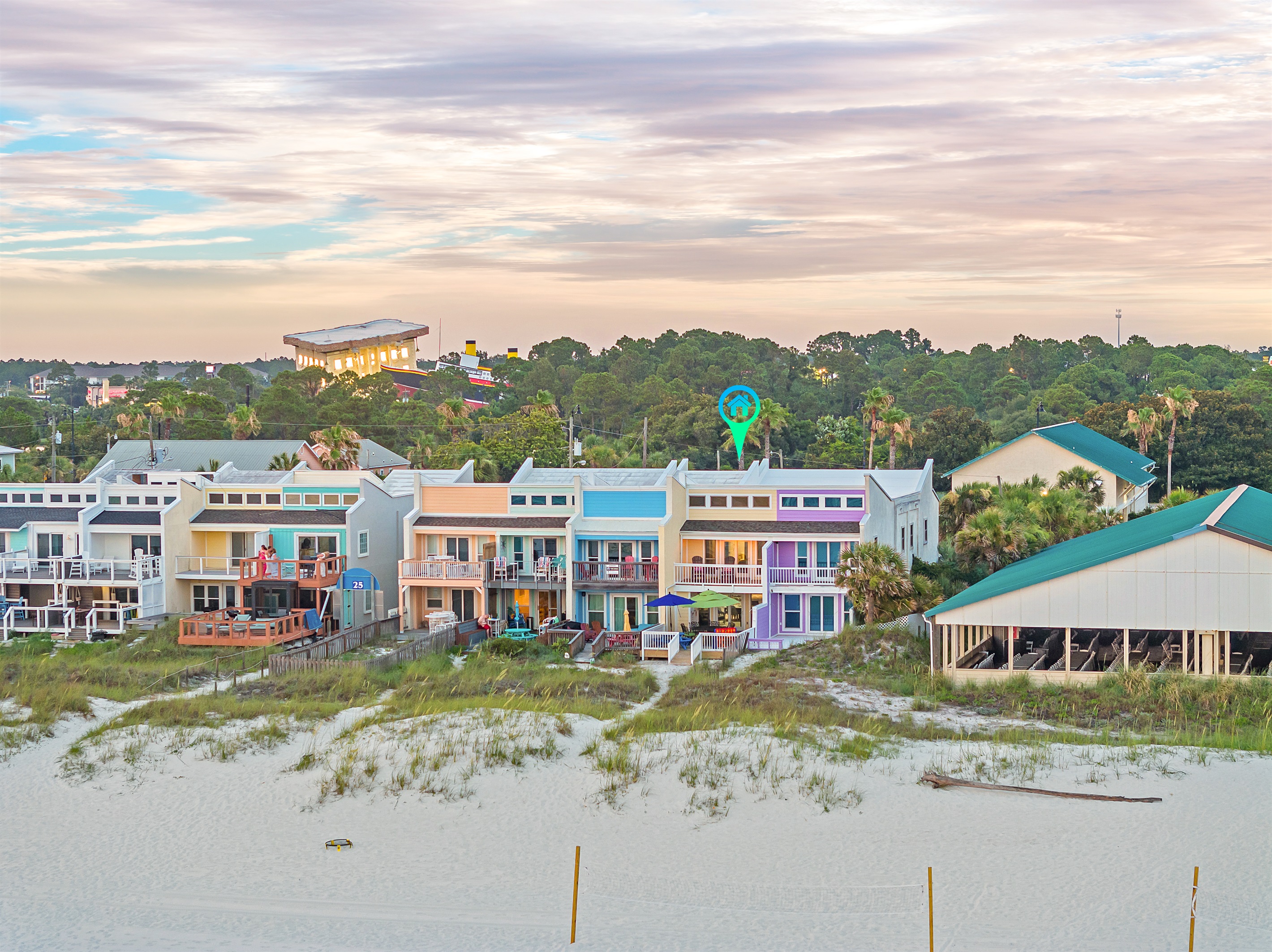 Enjoy a serene stay in these vibrant, beachfront townhouses. Perfectly located with direct access to the pristine white sands and crystal-clear waters, you'll experience the ultimate coastal getaway.