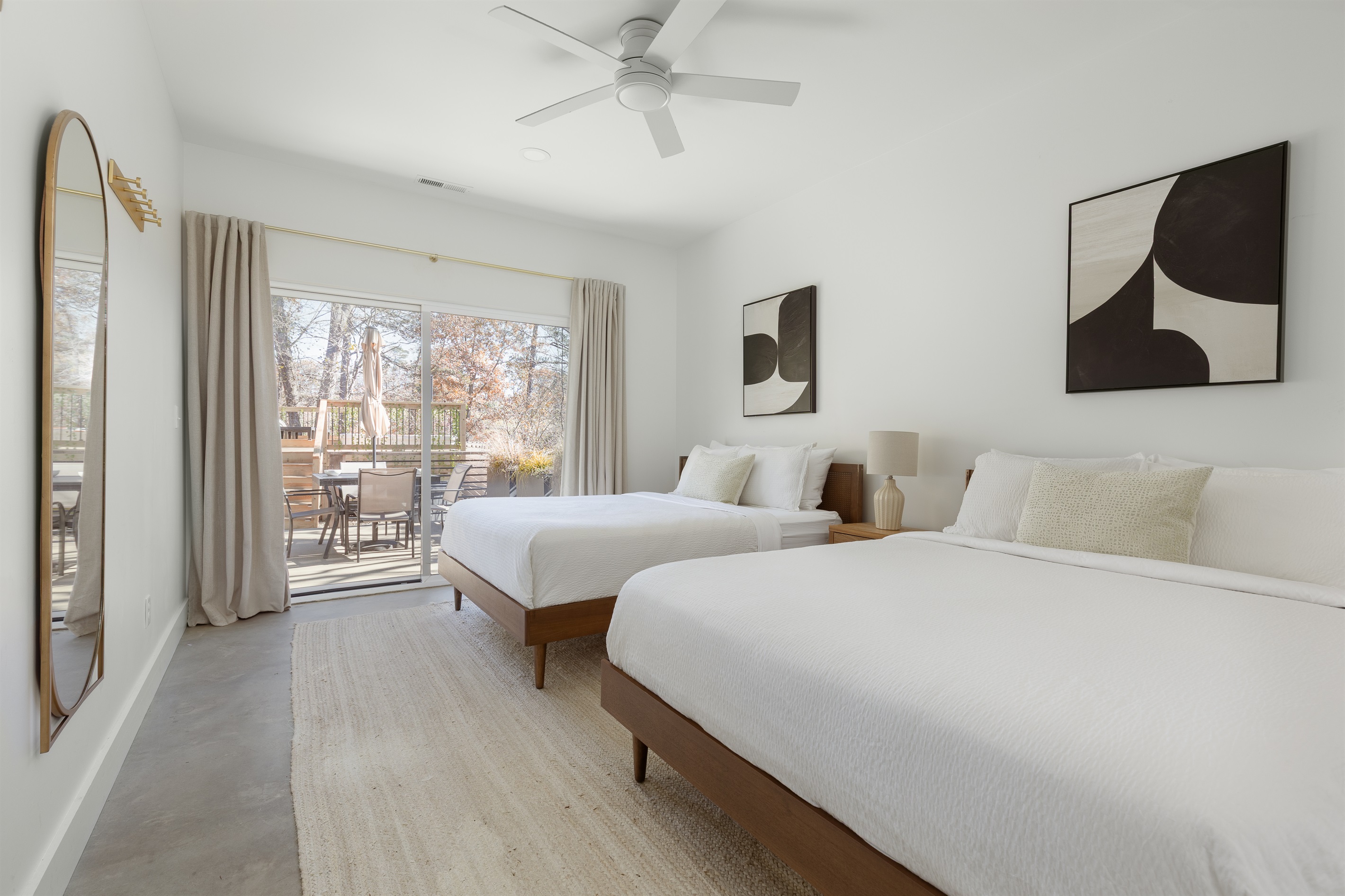 {Bedroom 2 - Gallery House} A serene space with two queen beds, soft linens, and sliding doors to the deck—perfect for morning light and fresh mountain air.