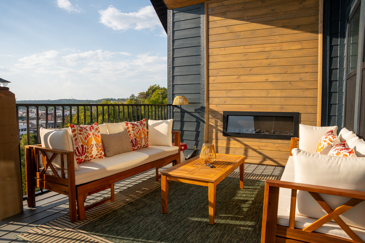 Gather around the outdoor fireplace for cozy evenings on the covered deck.