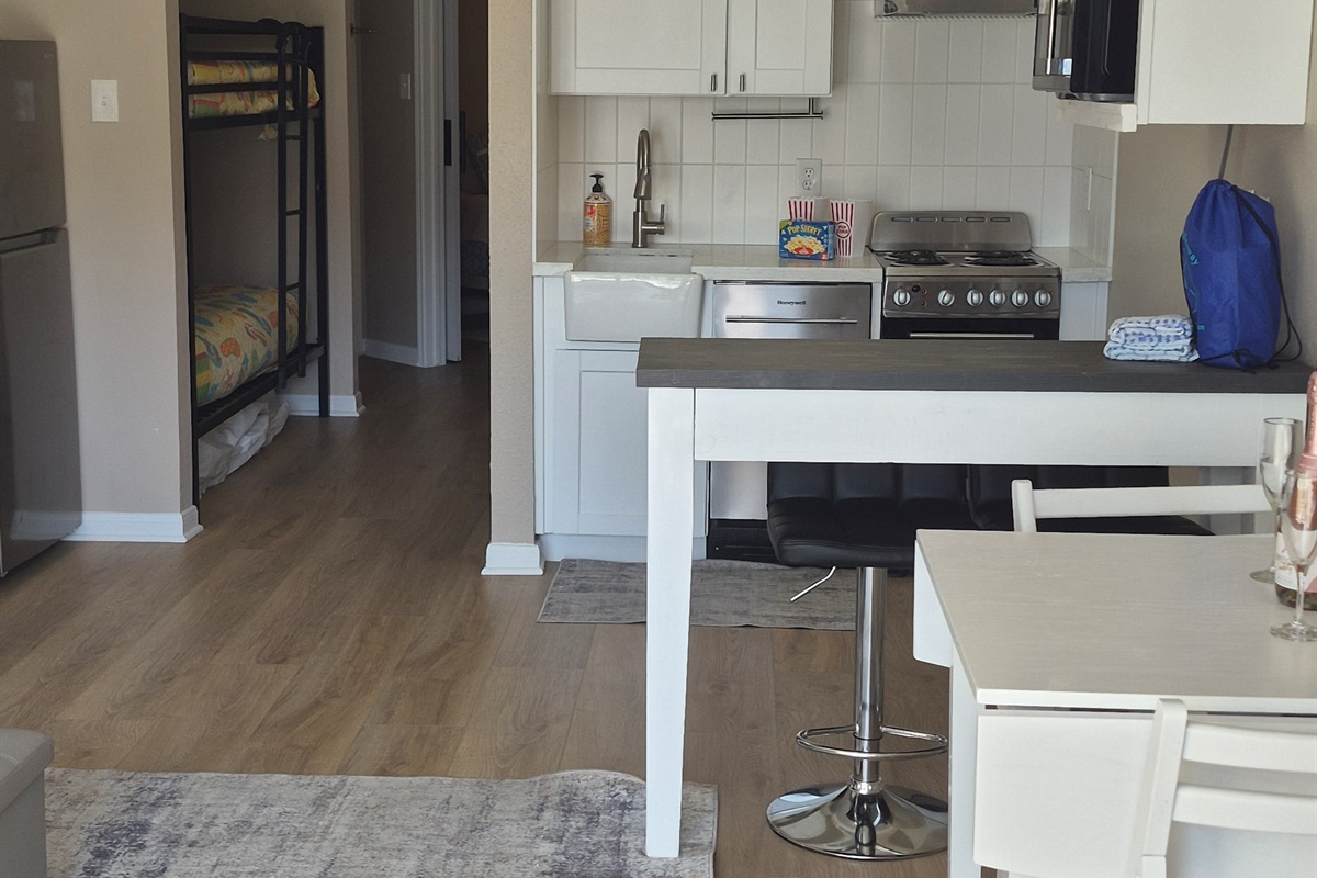 Look inside from the balcony to the open concept living/dining areas