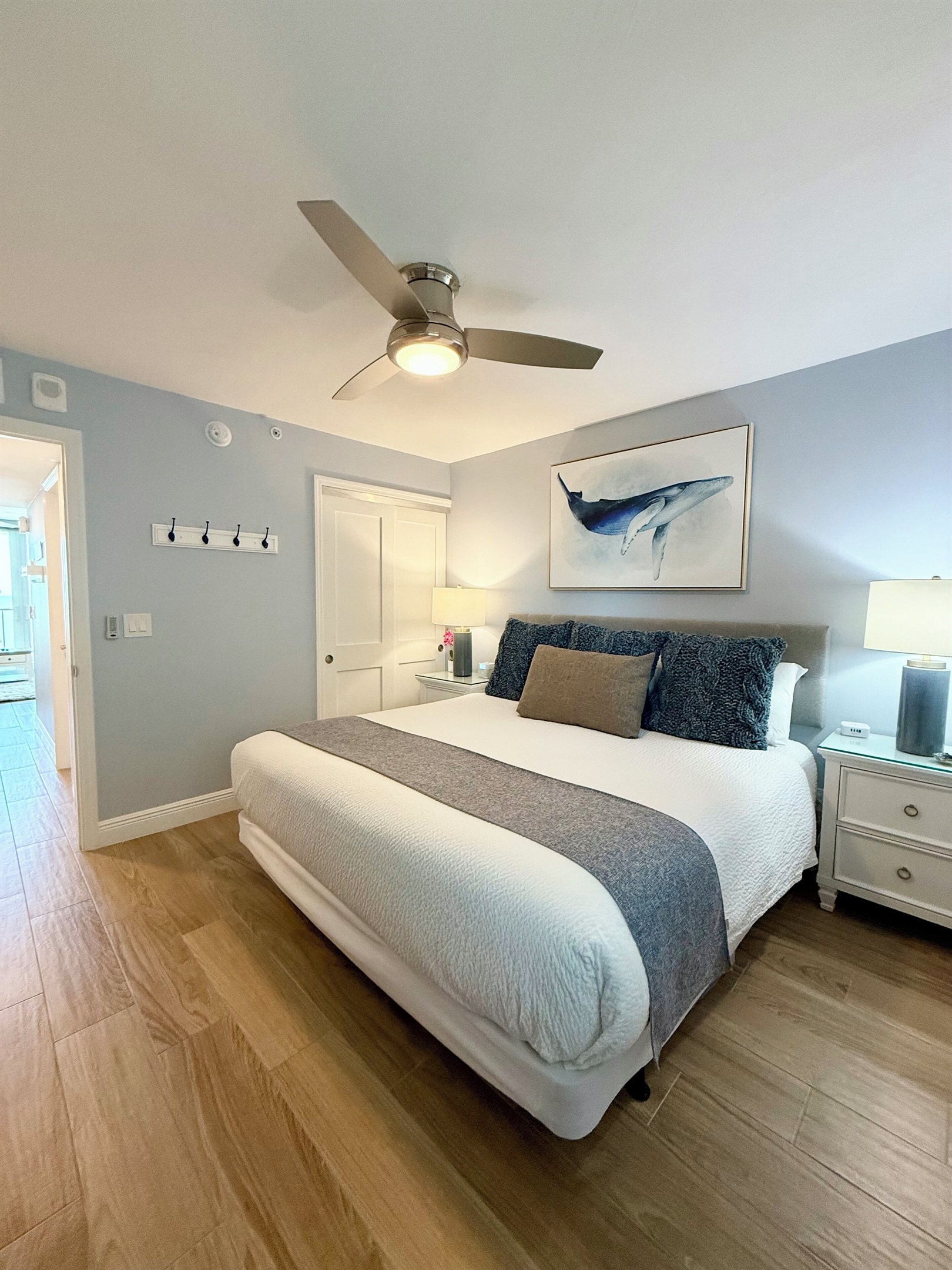 New King bed. Wall hooks for jackets, purse, tote, etc.