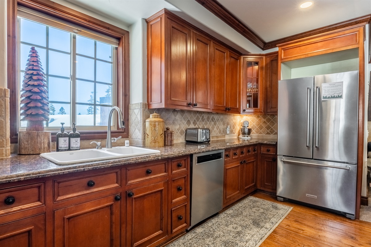 The gourmet kitchen with granite counters, custom cabinetry, and plenty of prep space for group meals.