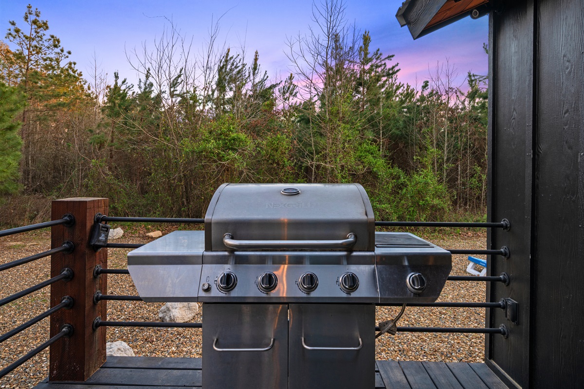 The grill setup on the deck makes outdoor cooking easy and enjoyable, perfect for casual meals with family and friends.