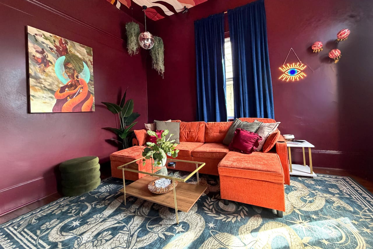 Stylish lounge space with plush velvet seating, moody walls, and bold New Orleans design.  Perfect for relaxing, cocktails, or planning your night in the nearby French Quarter and Marigny nightlife district. 