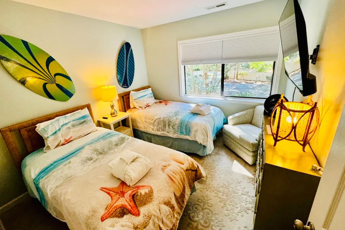 Bedroom with two beds and beach decor