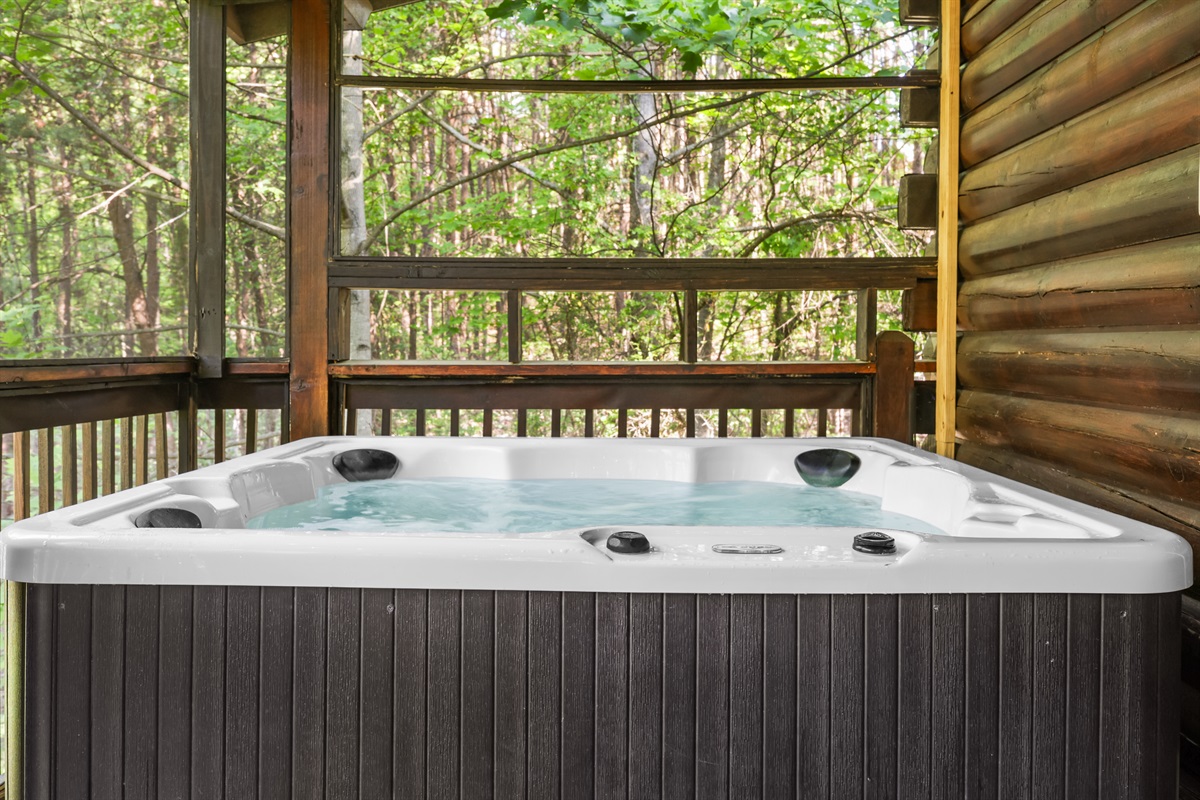 The hot tub is on the screened in porch so you can relax in any season