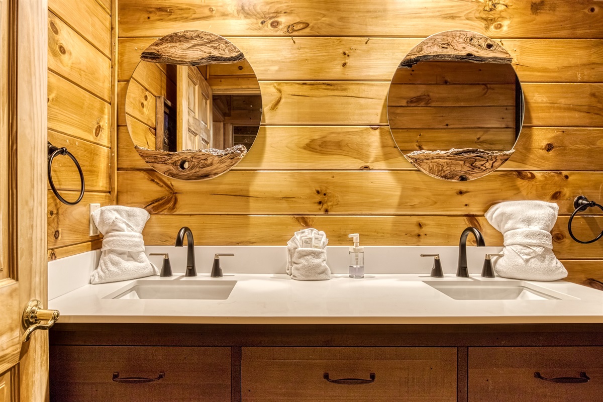 Double sink vanity in common bathroom on the main level