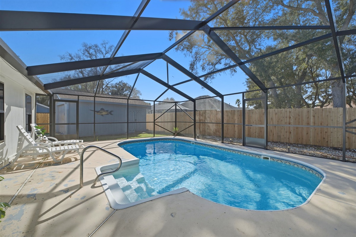 This spacious screened pool area offers the perfect spot to cool off, relax, and enjoy Florida sunshine. With plenty of room for lounging and swimming, it’s ideal for both laid-back afternoons and fun with family or friends.