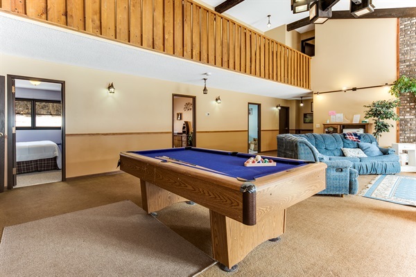 The Great Room connects to the first three bedrooms on the main level, then the second three are up a flight of stairs.