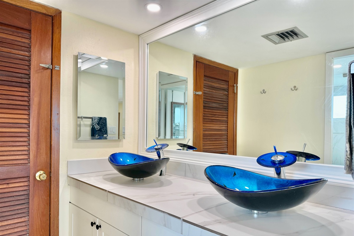 Ensuite bathroom with double sinks just off the primary bedroom