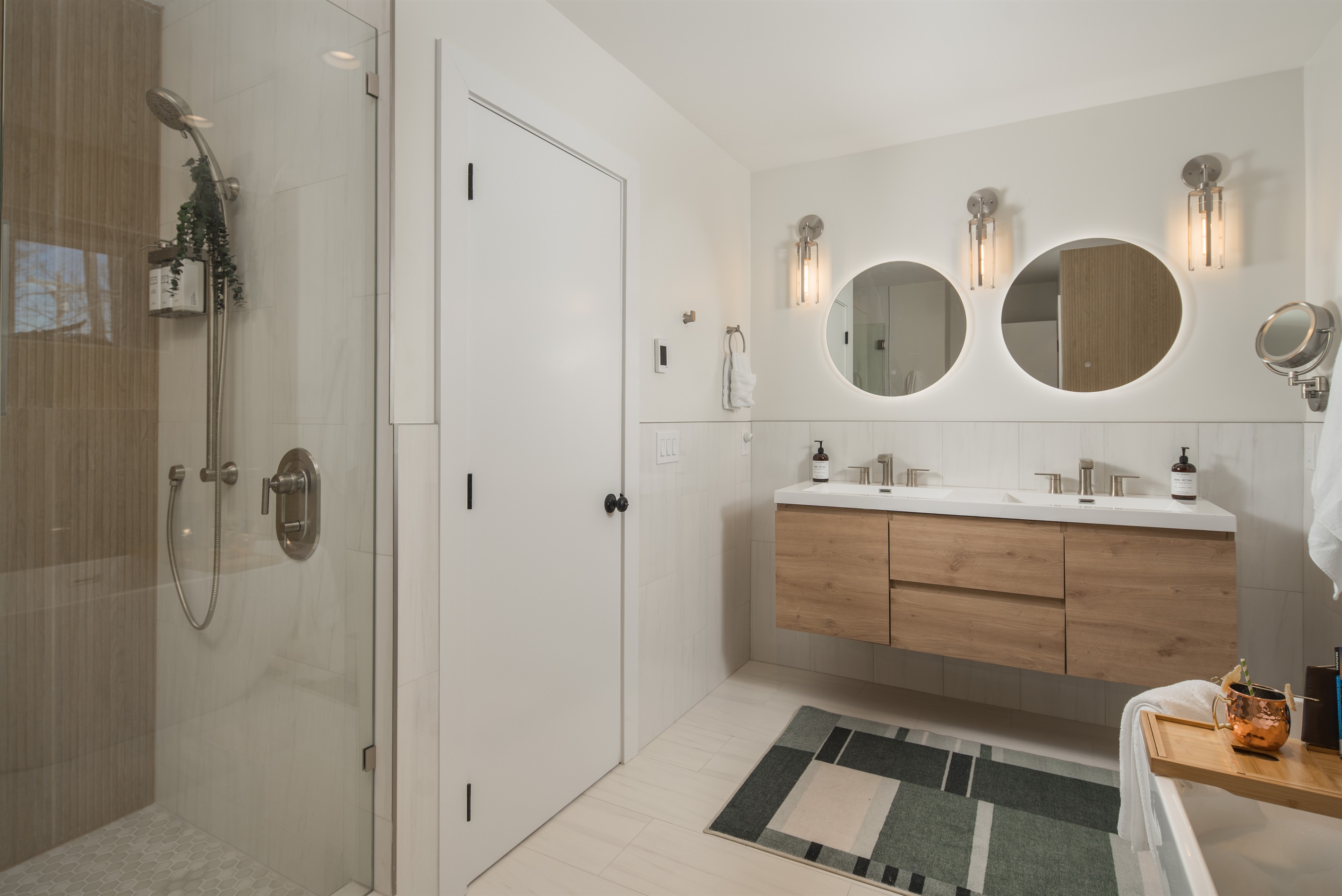 The bath also features heated floors, lighted mirrors, makeup mirror, and a hair dryer.