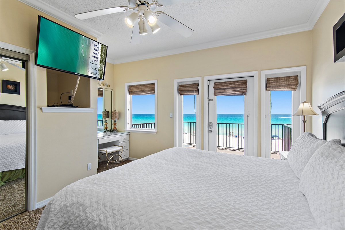 SPACIOUS Master Bedroom features a King Bed, Workspace, and BIG Gulf Views off of the 3rd Floor Private Balcony