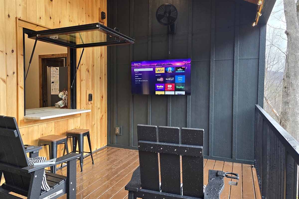 Flip up window provides access to the bar inside the cabin