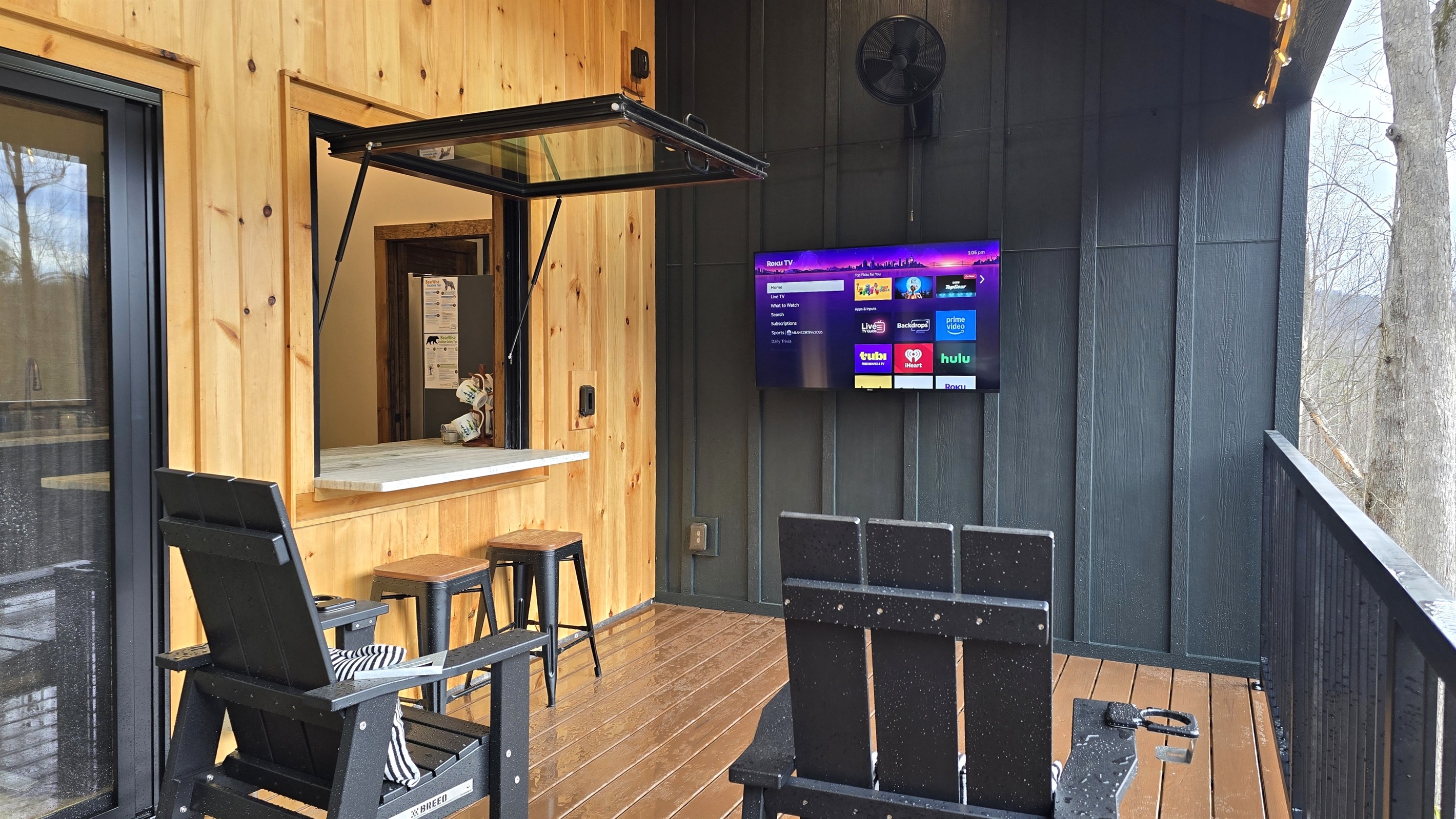 Flip up window provides access to the bar inside the cabin