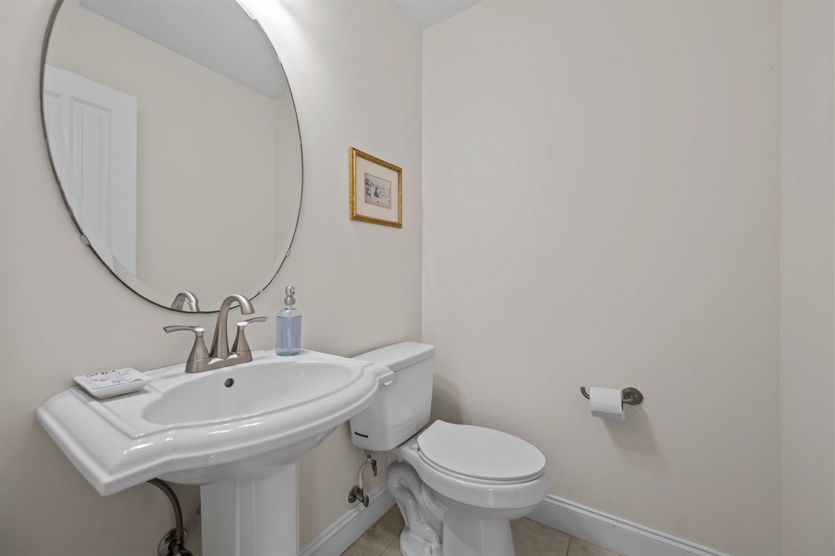 1st-floor powder room with pedestal sink and modern fixtures