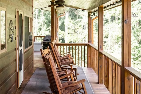 porch facing backyard with barbecue grill