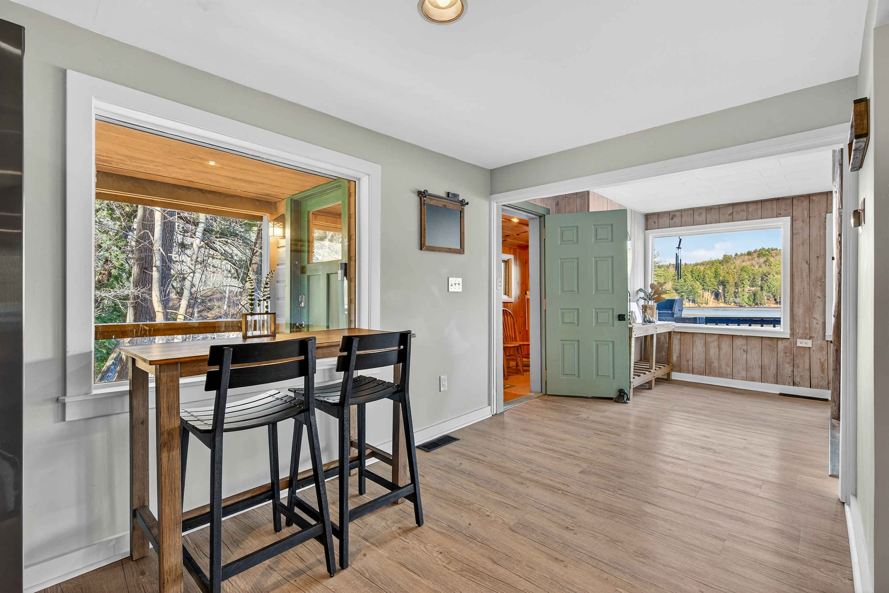 Dining nook adjacent to the kitchen with outdoor access.