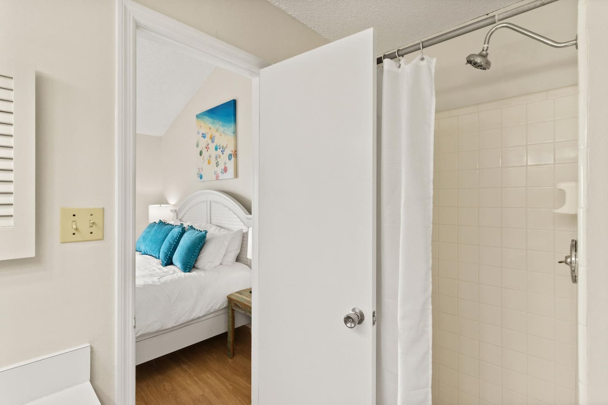 Step into the master bath walk-in shower after a day in the salt water &mdash; pure relief.