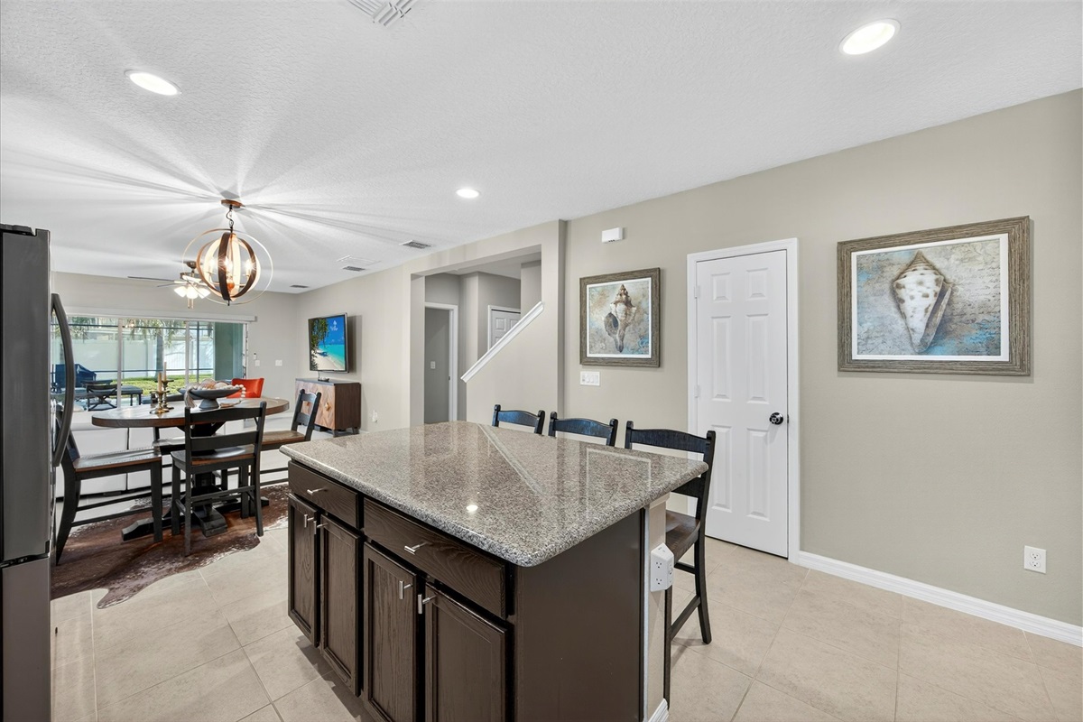 Kitchen features a large island and breakfast bar for casual dining.