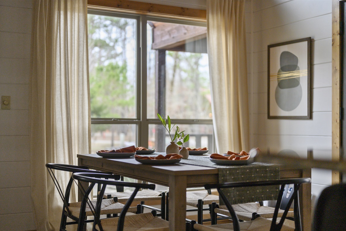 Dine with a view in our cozy dining nook, where every meal comes with a side of sunshine and scenery