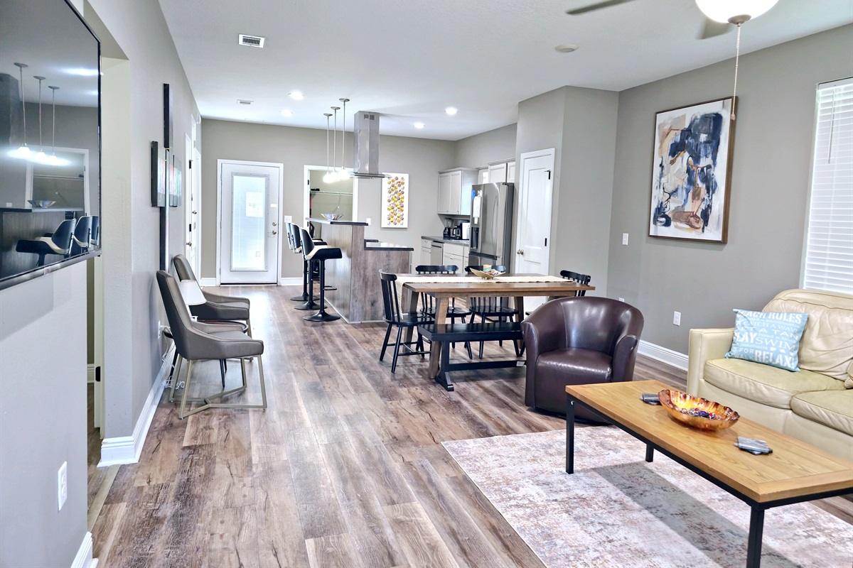 Large wall mounted smart TV in the Livingroom and LVP flooring