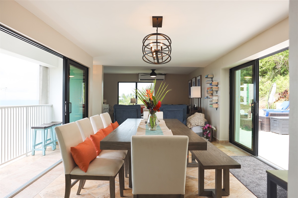 Dining area with direct access to the outdoor patio and pool deck for seamless al fresco dining.