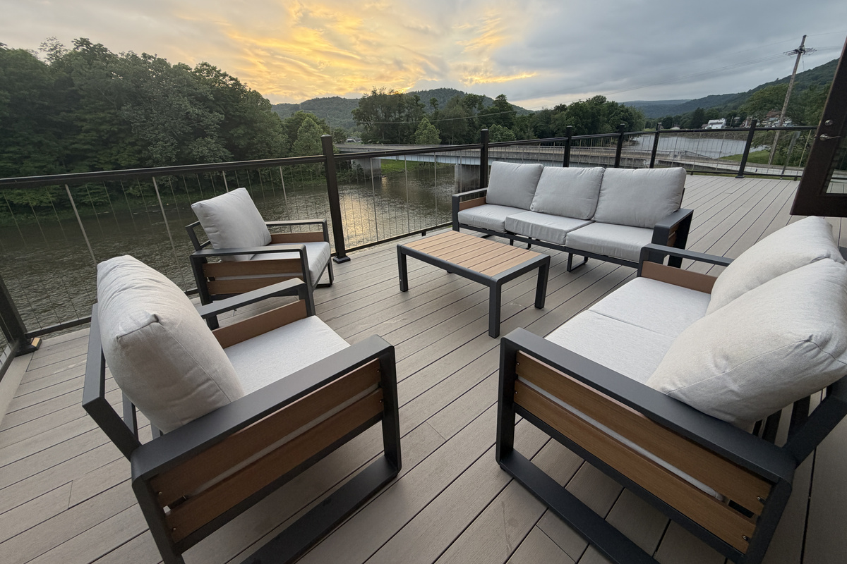 large riverside deck facing downstream towards town