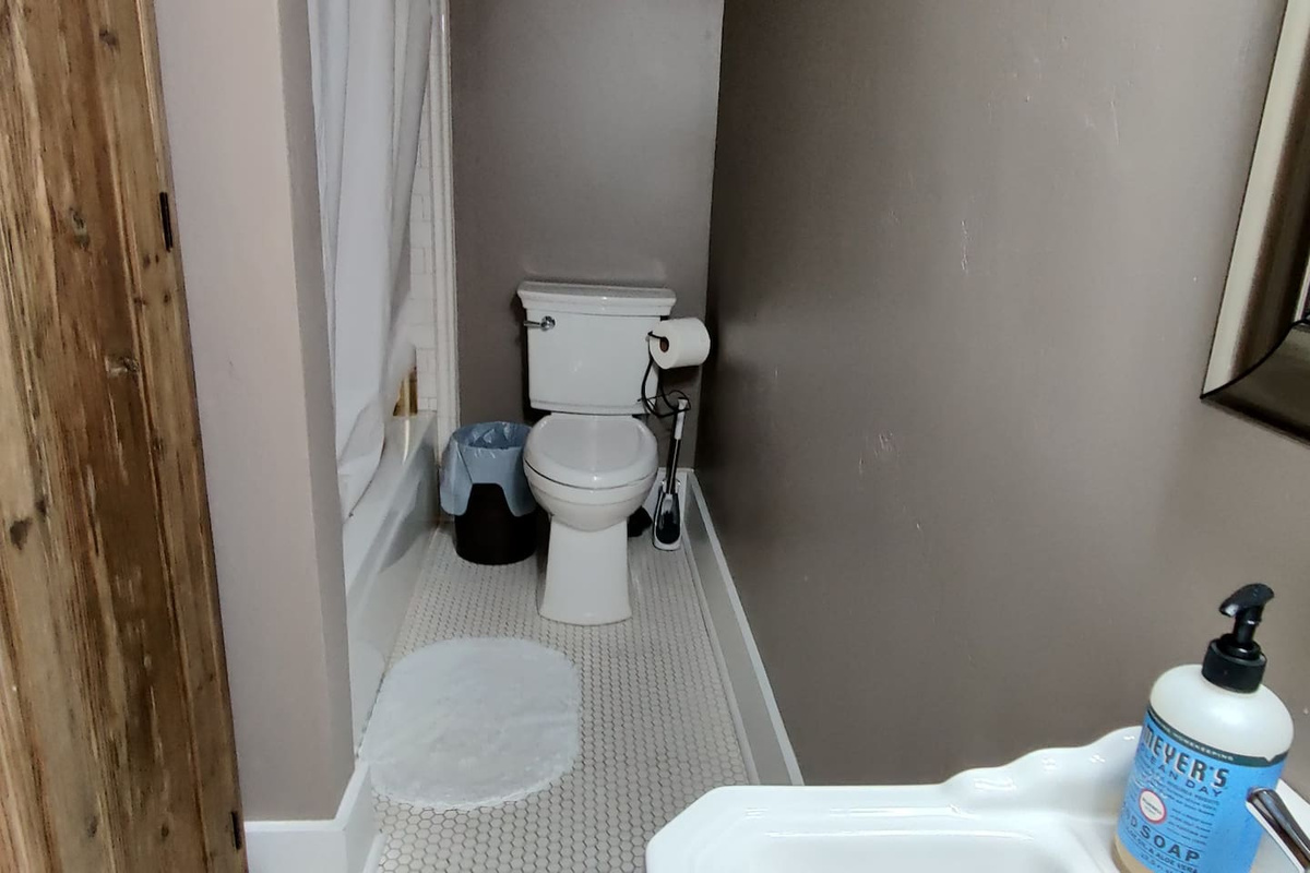 Main floor bathroom with shower and bathtub. 