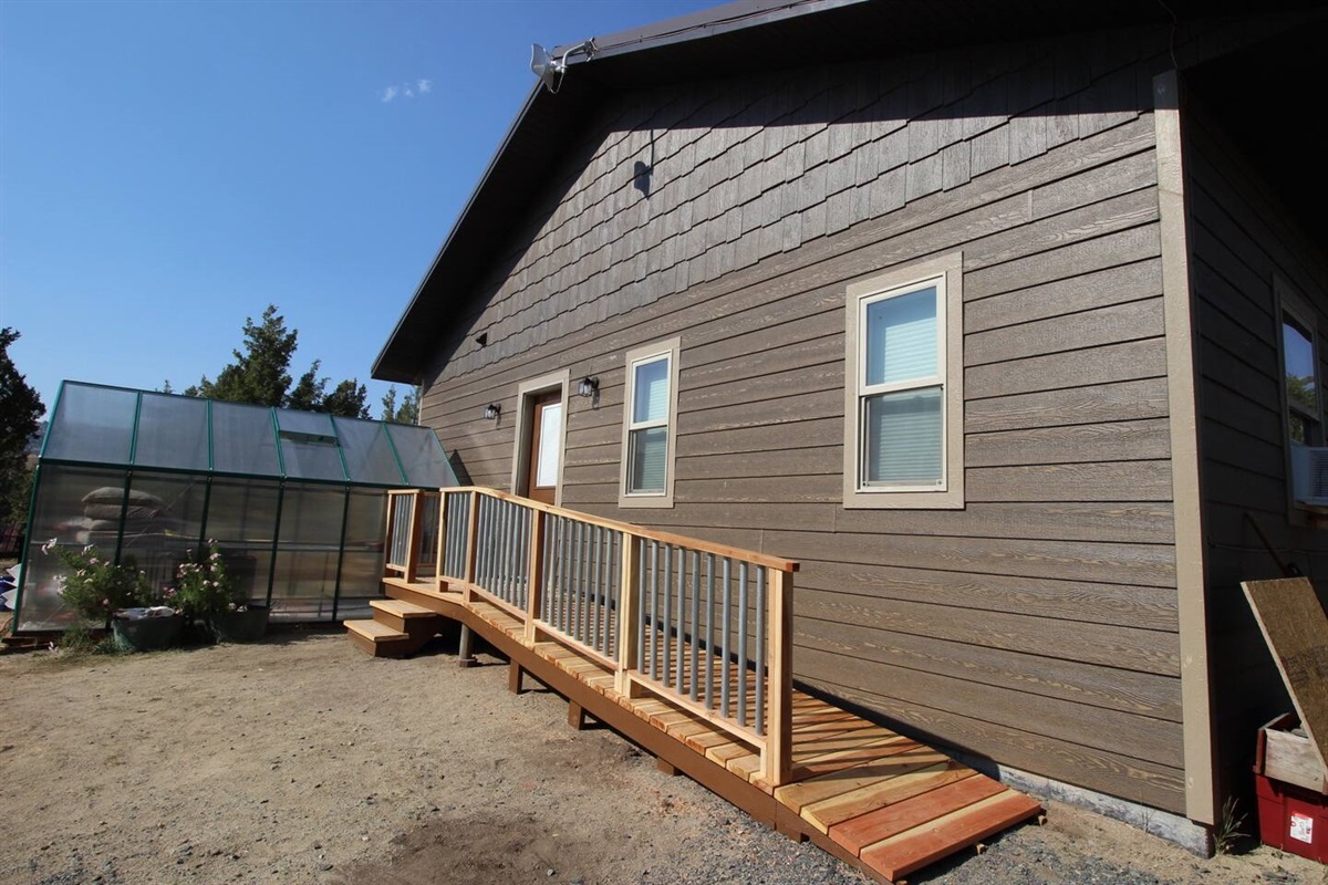 Step-free ramp access and a sunny attached greenhouse make the home as welcoming as it is full of character.