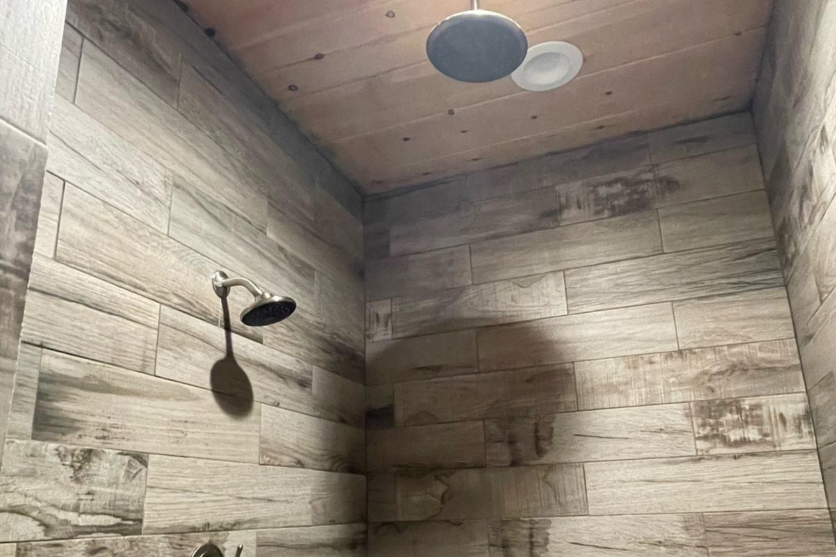 Downstairs luxurious master bathroom and overhead rain shower head.