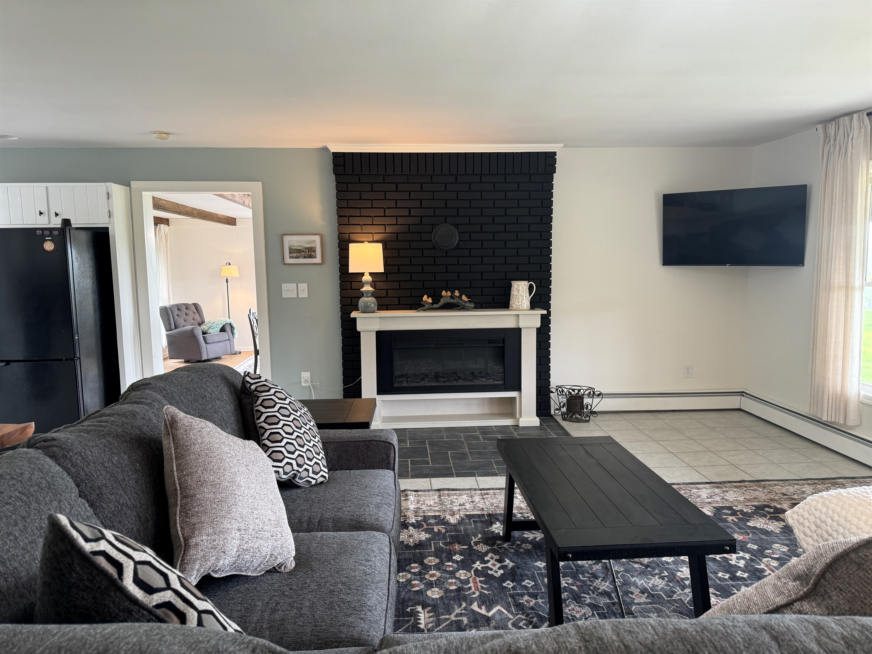 Living room with electric fireplace and SmartTV