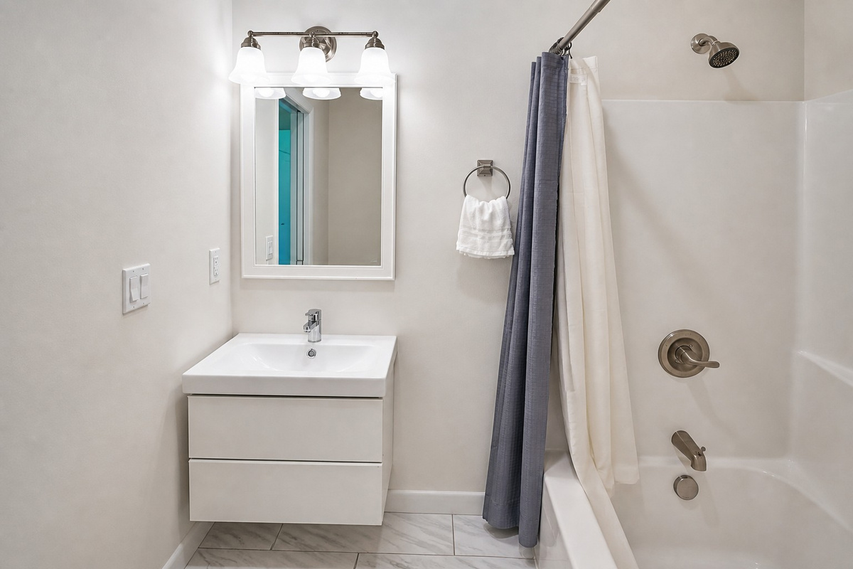 Hall bathroom with tub and shower