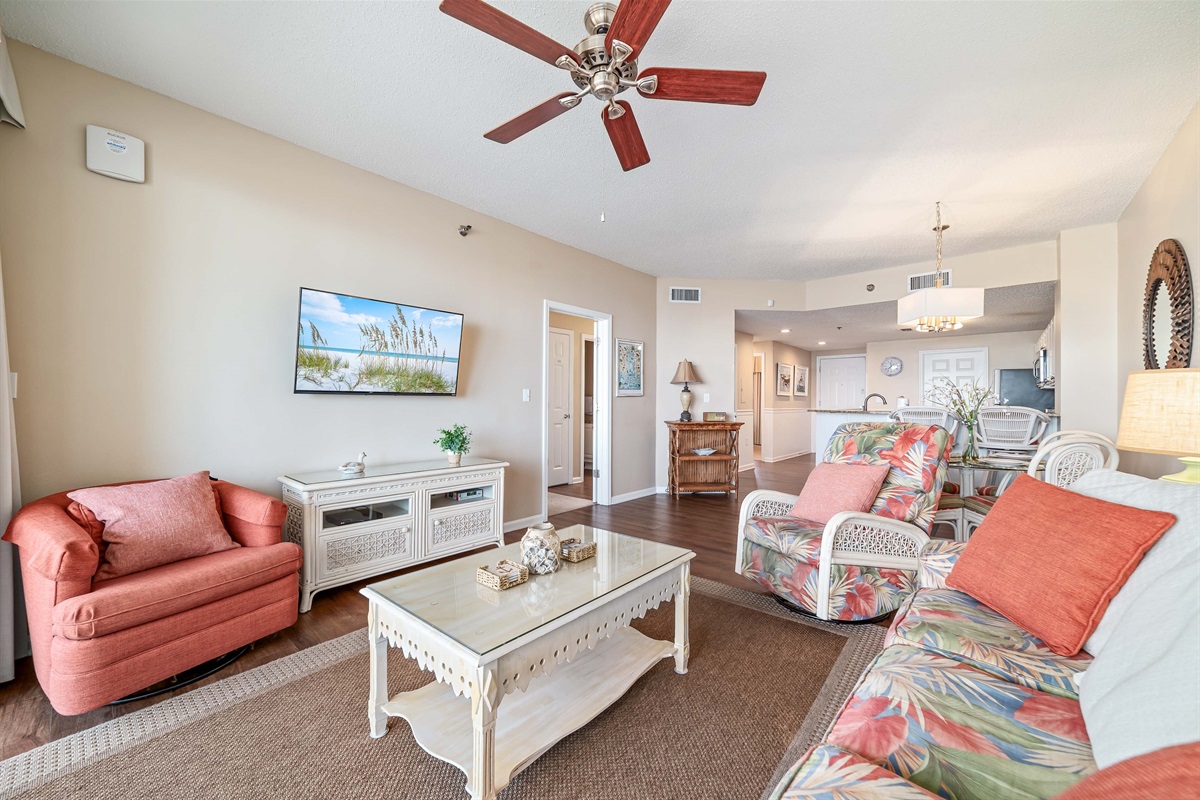 Light and airy living space featuring coastal-inspired decor and a seamless flow between the living and dining areas.