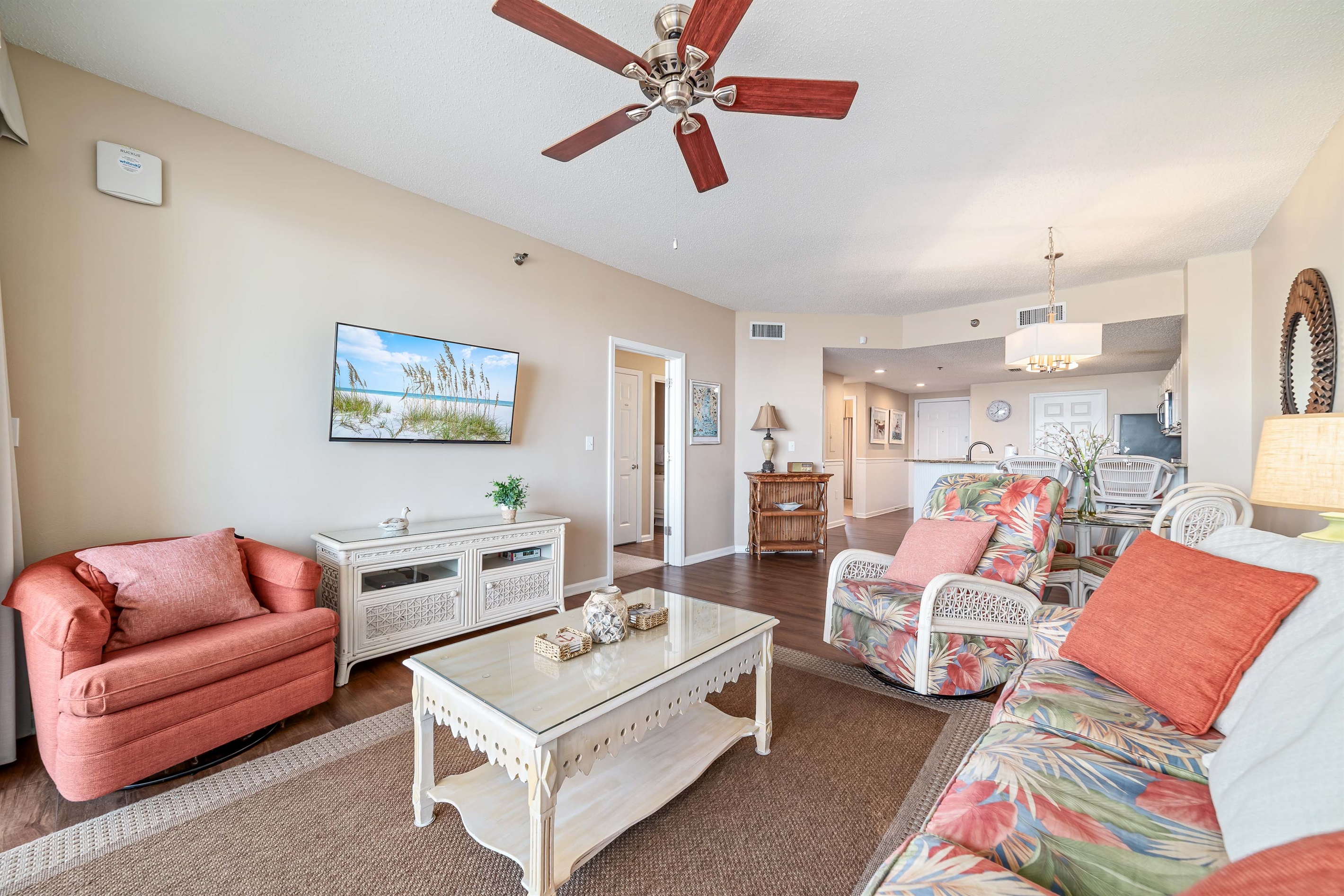 Light and airy living space featuring coastal-inspired decor and a seamless flow between the living and dining areas.