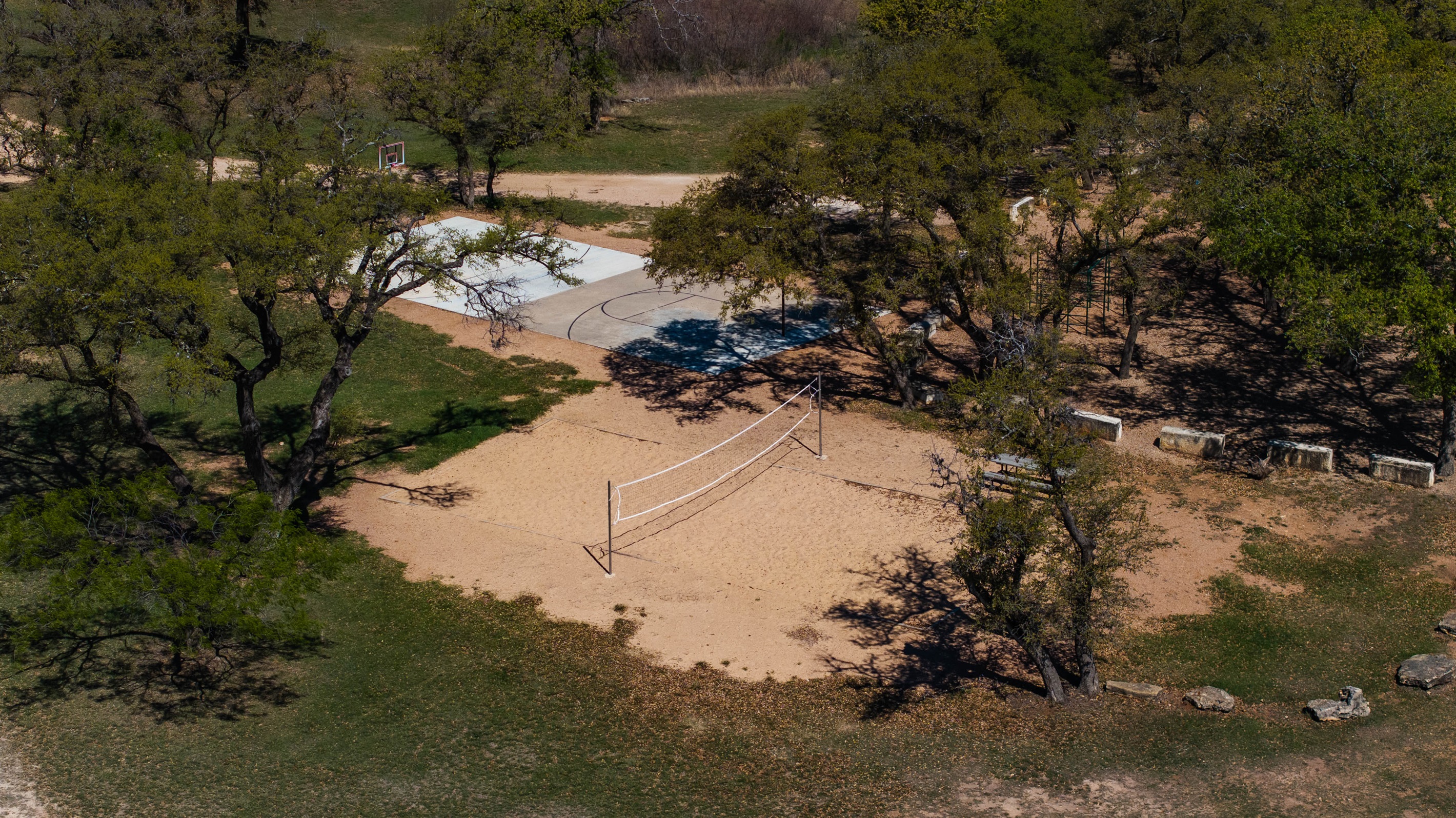 Sand volleyball court and basketball for guest use