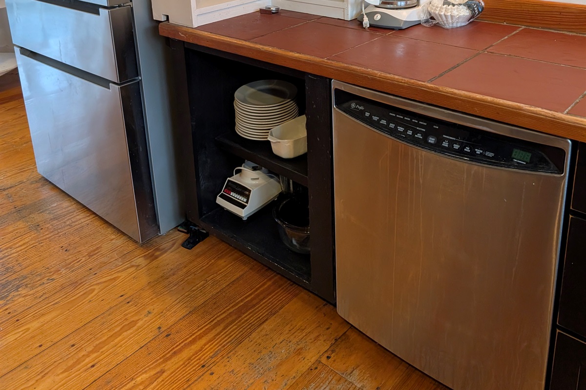 Fully equipped kitchen with dishwasher and stocked cabinets for easy meal prep and cleanup.