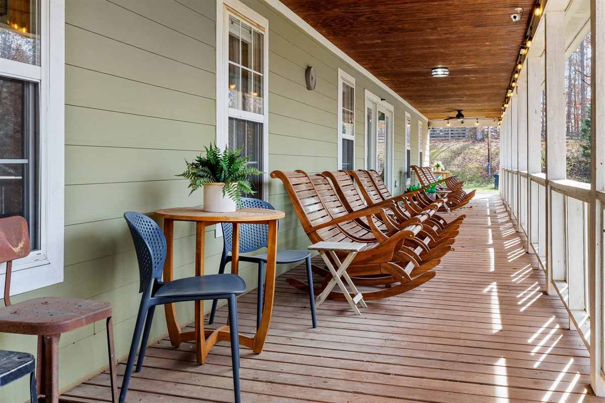 Lined with rocking chairs and side tables.