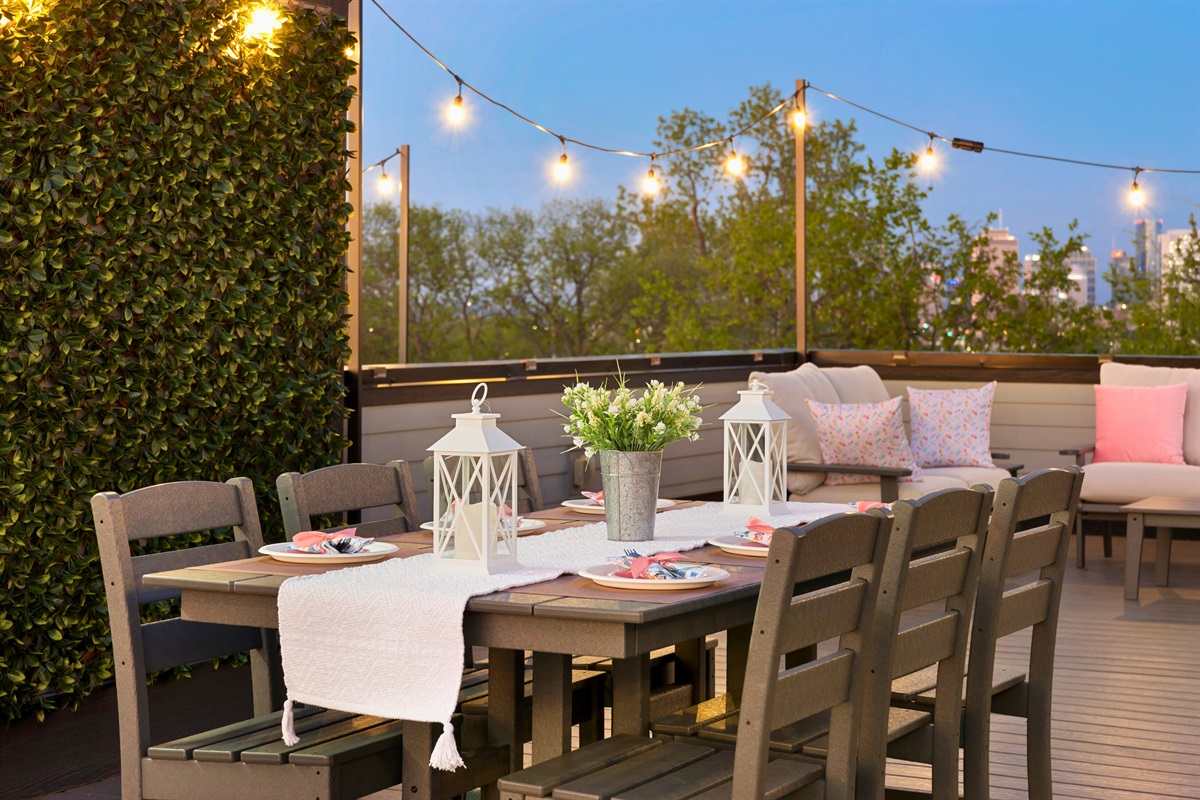 Enjoy a Meal Under the Lights on our Serene Rooftop Patio.