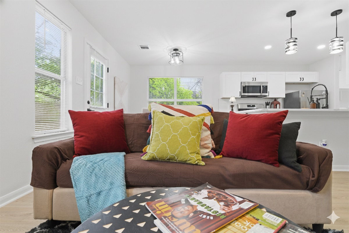 comfy and spacious living room , with big TV