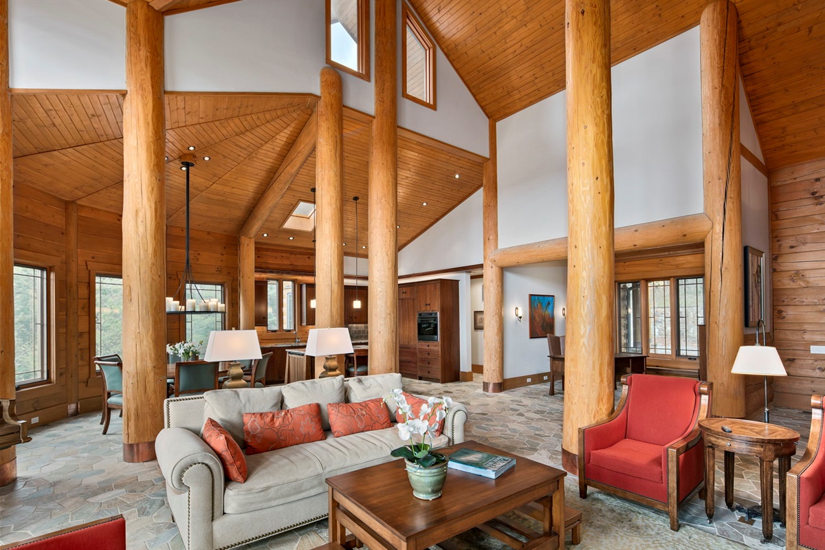 Regal build quality with cathedral ceilings, massive wooden beams and columns, open flowing floor plan