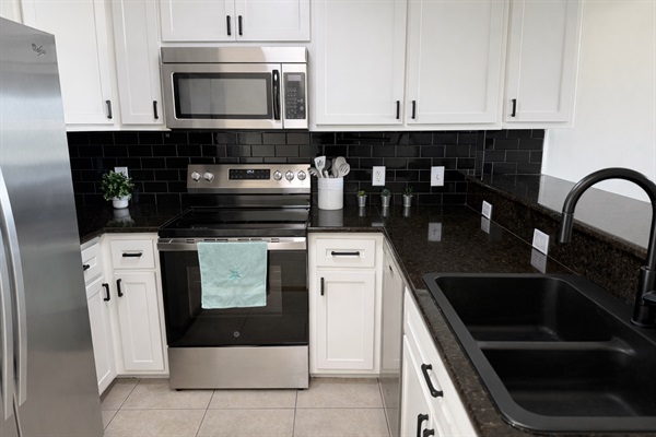 Fully equipped kitchen with stainless steel appliances 
