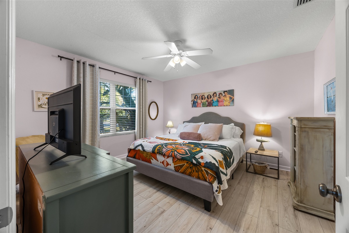 Beautifully decorated primary bedroom with cozy bedding and soft lighting for a restful night’s sleep.