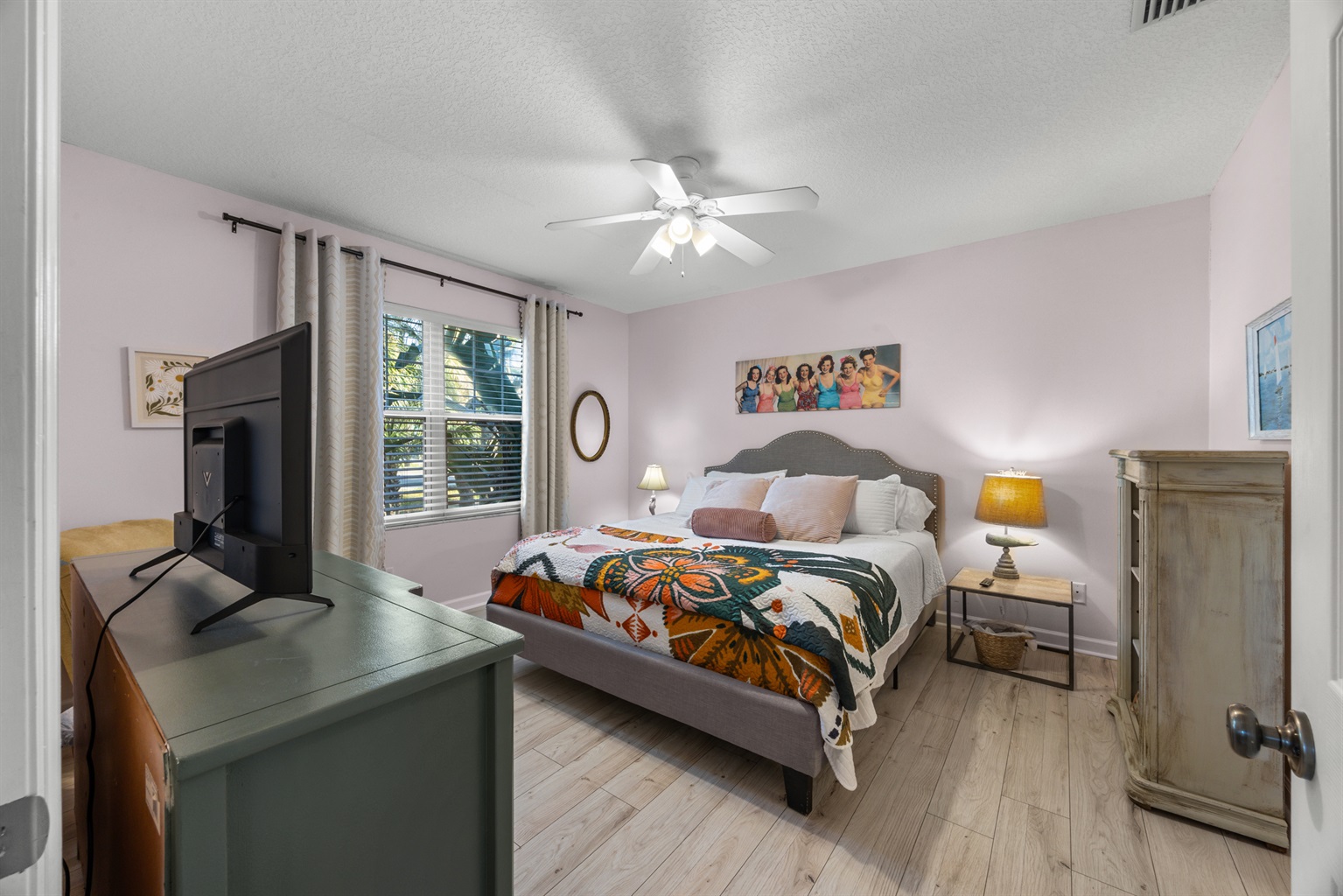 Beautifully decorated primary bedroom with cozy bedding and soft lighting for a restful night’s sleep.