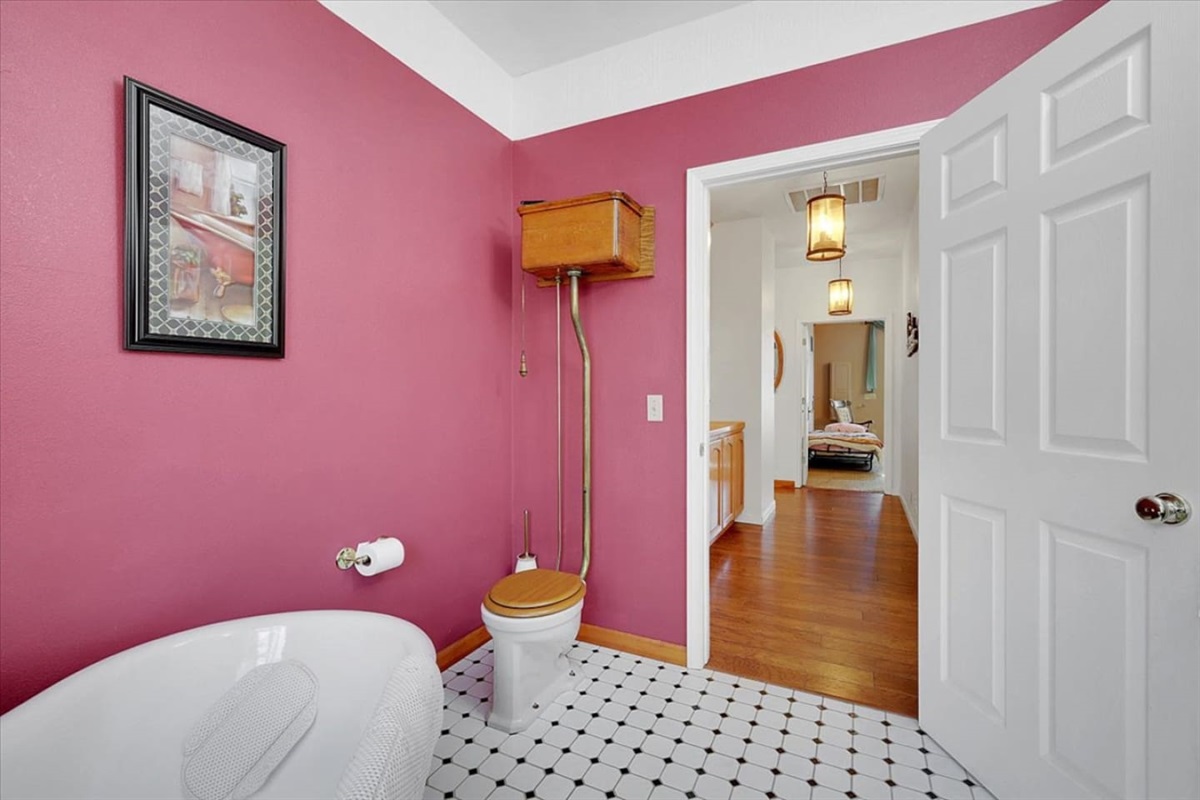 Full bathroom 2 with a clawfoot tub, pedestal sink, and a classic vintage-style look.
