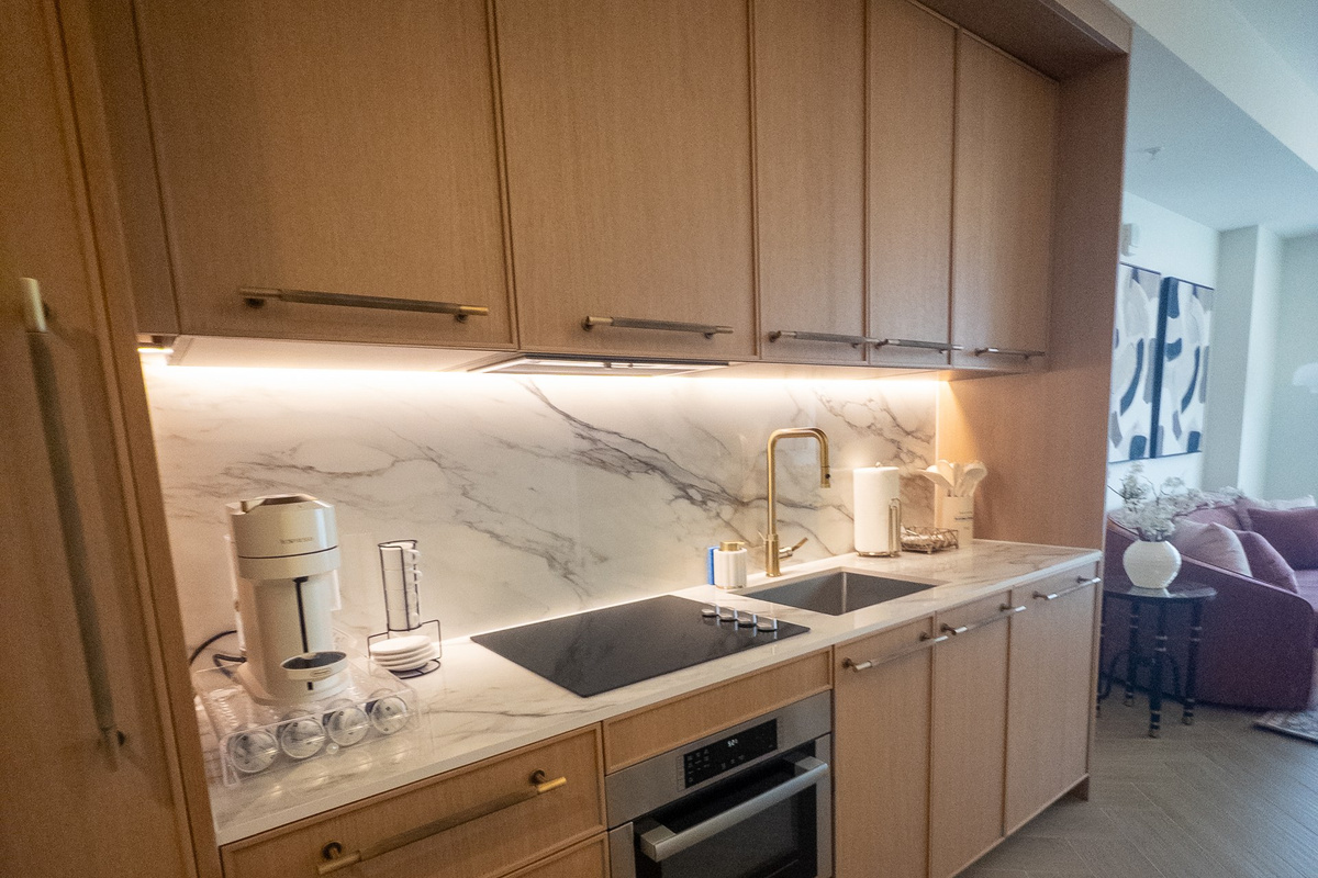 Whip up coffee against the marble backsplash - full-size cooktop, oven and everything you need to cook like home.