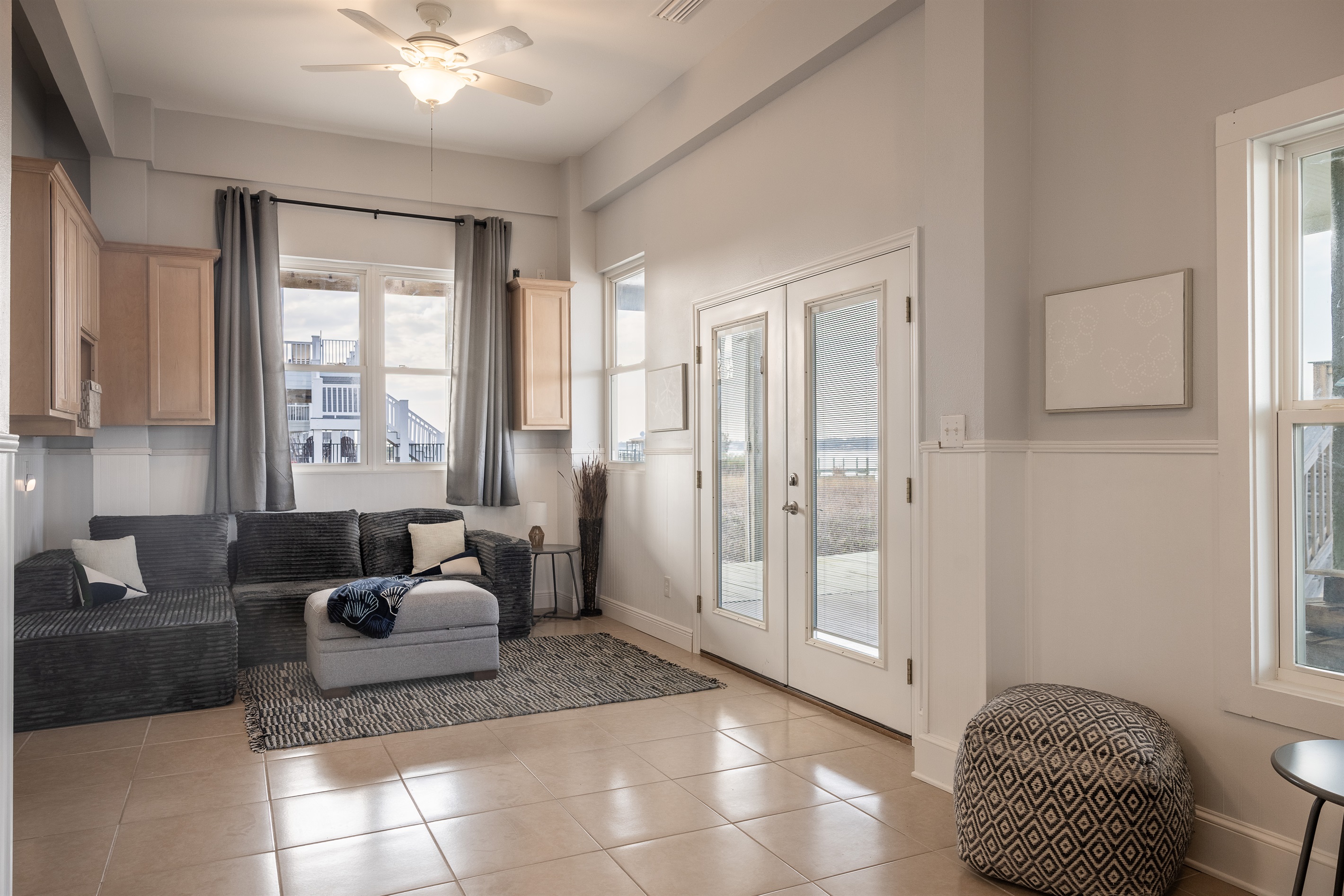 Playroom/Bonus Space with sleeper sofas and 65 inch Roku TV. Direct access to dock and Lagoon views.