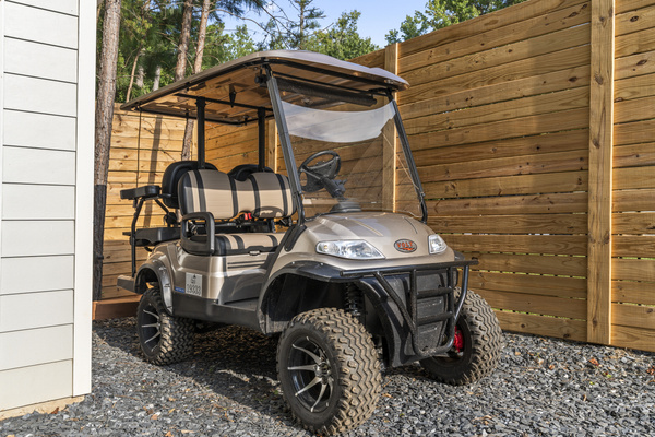 Golf cart to use for easy transportation down the wooded path to the lake.