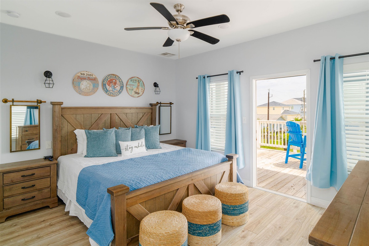 King Guest Suite upstairs — rustic wood headboard, King bed, private ensuite. The second grown-ups' retreat.
